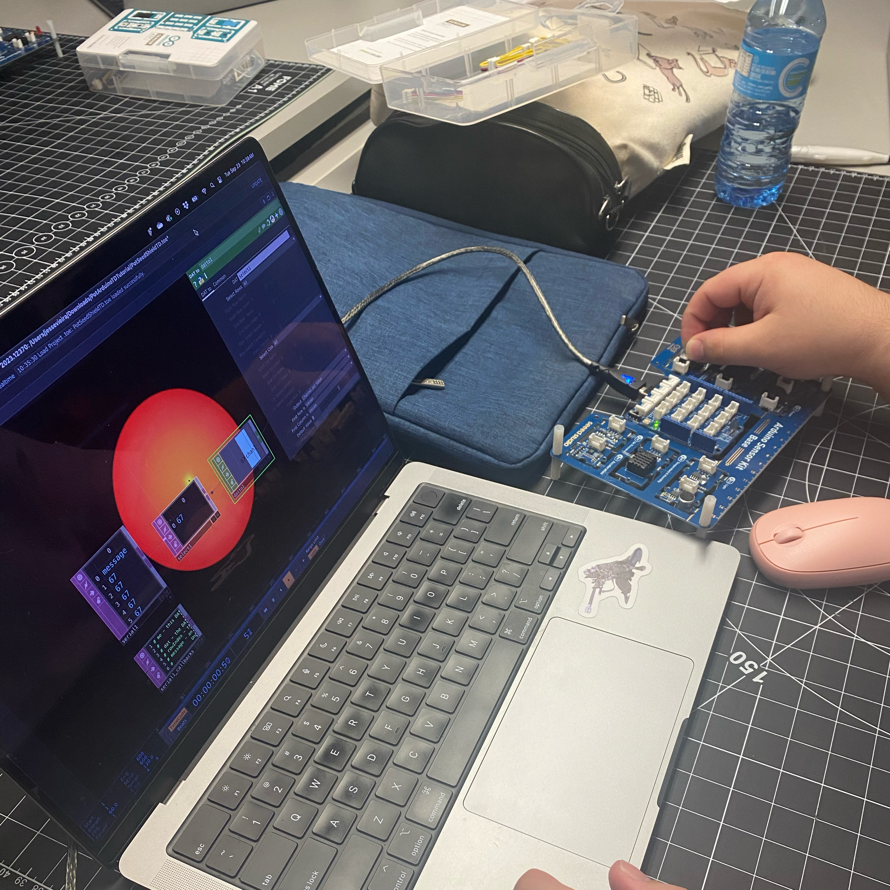 This is a physical image of Jesse turning the Knob. Some of the data was blocked, so we had to press an arrow to let it flow through.