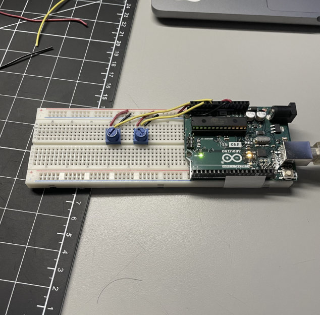 Now testing with two knobs. We also reformatted the Arduino wiring to keep it clean. We wanted to keep it neat as we would be putting this on our cardboard prototype. 